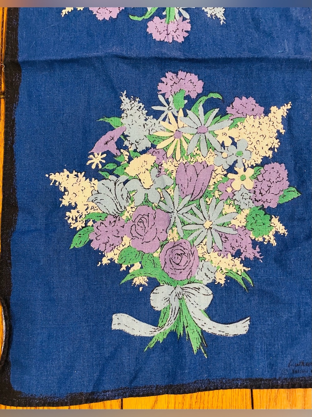 Vintage Signed Luther Travis linen kitchen tea towel, blue w/purple flowers